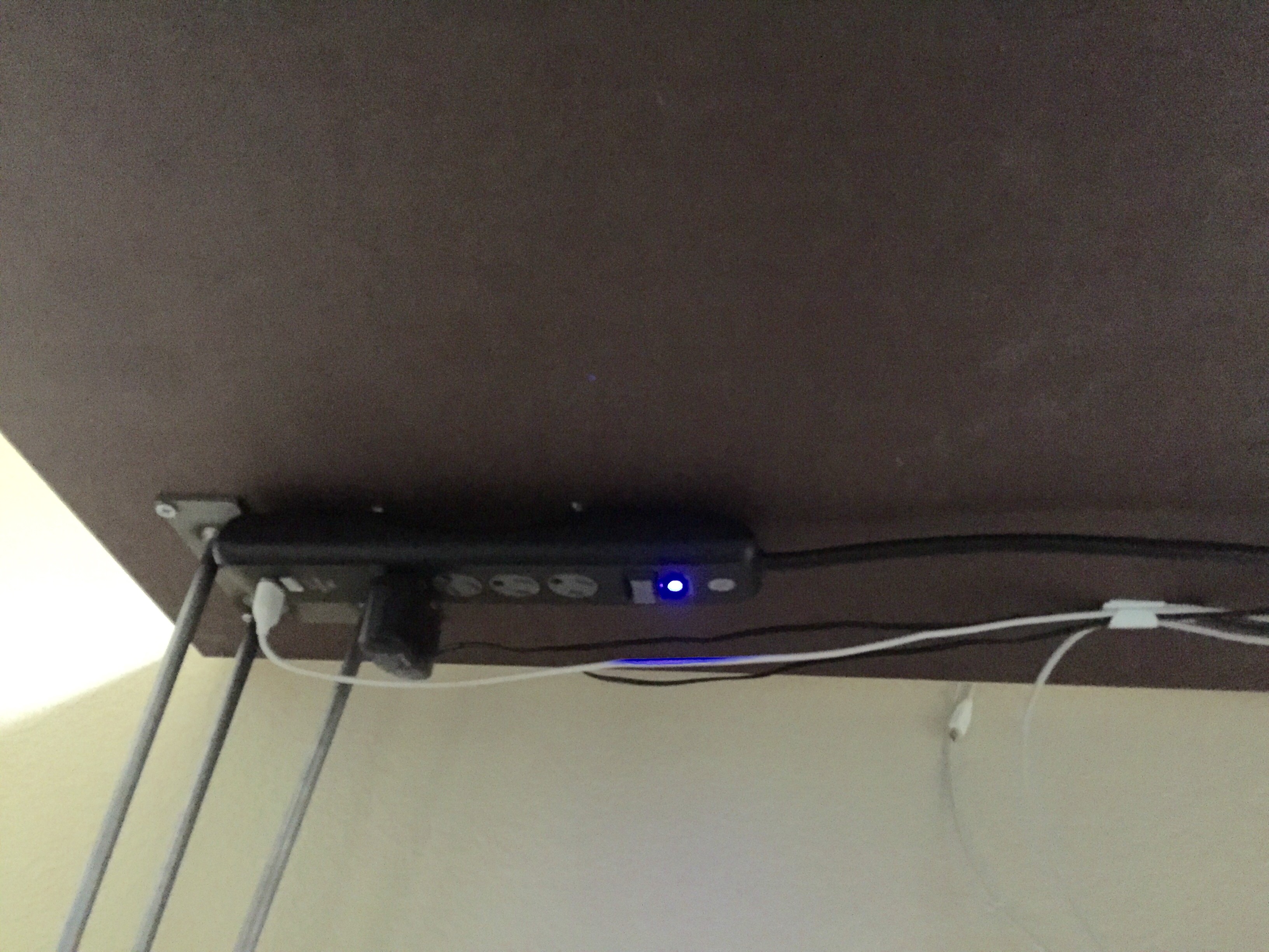 Attached power strip to desk top